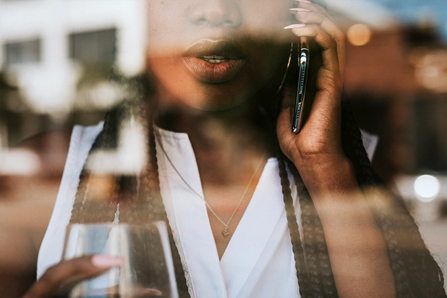 Woman on smartphone after number from business displays incorrectly