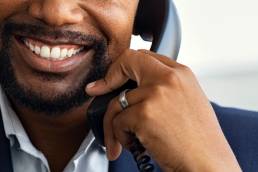 Sales professional on a sales call made possible with VoIP.